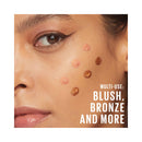 Close-up of a woman's face with makeup products on her skin, featuring text 'Multi-use: Blush, Bronze and More'.
