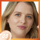 Close-up of a woman's face with a focus on skin texture, set against an orange border.