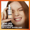 Woman holding a Maybelline Super Stay foundation bottle with text about skin-like coverage.