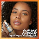 Woman holding a Super Stay makeup product with text about skin-like coverage on an orange background