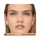 Close-up of a person's face with earrings, showing skin tone and makeup quality.