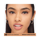 Close-up of a woman's face with neutral cool undertones, wearing earrings.