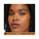 Close-up of a woman's face with neutral undertones makeup, unretouched.