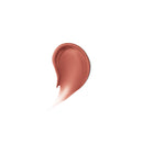 Nude-colored makeup swatch on a white background