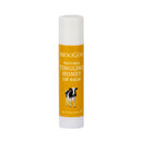MooGoo Natural Tingling Honey Lip Balm in a white tube with a mustard yellow label featuring a cow illustration.