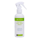 A white spray bottle of MooGoo Natural Tail Swat Spray with a green and white label, shown on a plain white background.