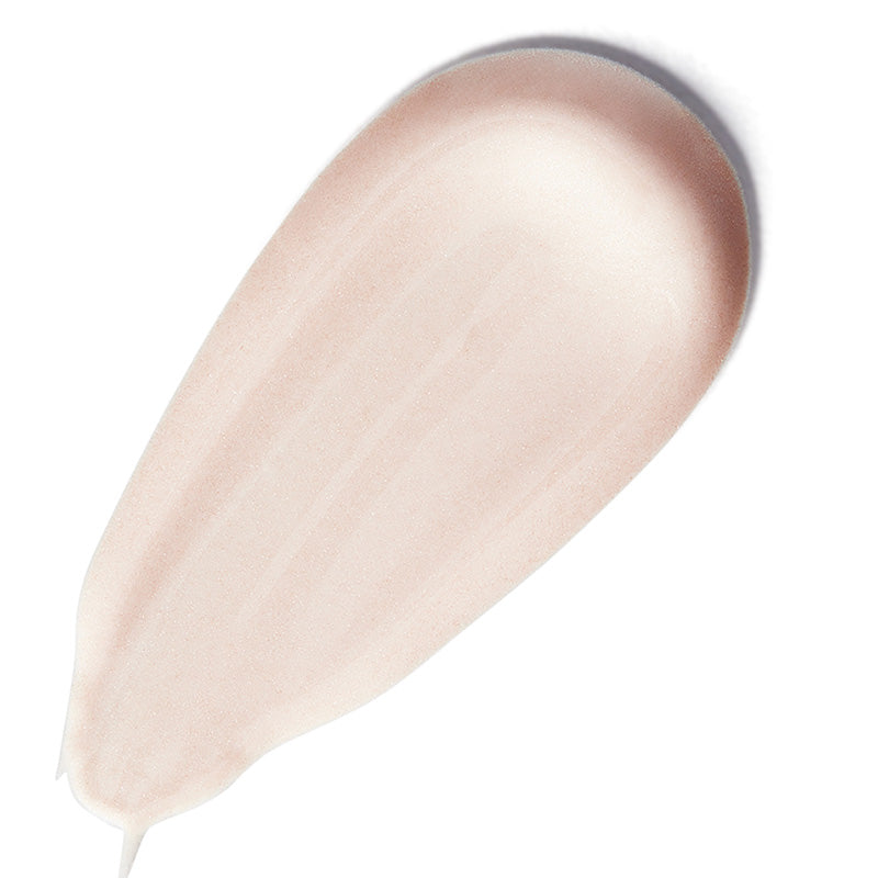 Close-up of a beige makeup product on a white background