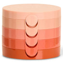 A stack of four round Natio cosmetic containers in a glossy peach-to-orange gradient, stacked vertically on a white background.