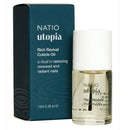Natio Utopia Rich Revival Cuticle Oil in a clear glass bottle with a white cap, shown next to its dark teal-blue packaging box on a white background.