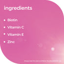 Pink informational graphic with the heading 'ingredients' and a bulleted list reading Biotin, Vitamin C, Vitamin E, and Zinc, plus small usage text at the bottom.