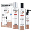 Nioxin hair care product set including shampoo, conditioner, and treatment on a white background.