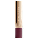 Lipstick with gold cap and burgundy body on a white background