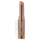 Lipstick with nude shade and 'Nude by Nature' branding on a white background