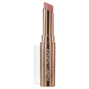 Lipstick with rose gold casing and 'Nude by Nature' branding on a white background