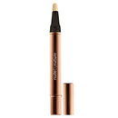 Cosmetic pencil with black cap and rose gold body on a white background, featuring 'nude by nature' branding.