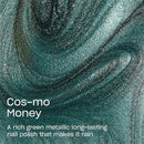 A close-up of a metallic nail polish texture in a rich green-teal shade, with swirling glittery layers and white text reading 'Cos-mo Money' and a descriptive product phrase.