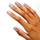 Hand with pink nail polish on a white background