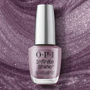 OPI Infinite Shine nail polish bottle on a glittery purple background