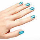 Hand with blue nail polish on a white background