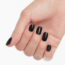 Hand with black nail polish on a white background