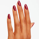 Hand with red nail polish on a white background