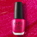 OPI nail polish bottle on a pink glittery background