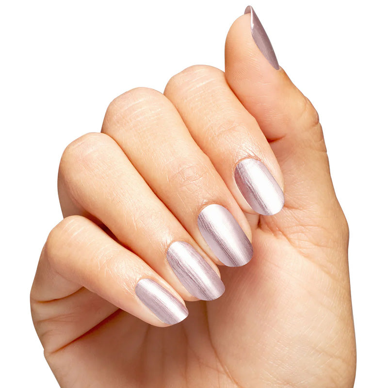 Hand with light purple nail polish on a white background