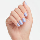 Hand with light purple nail polish on a plain background