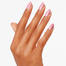 Hand with pink nail polish on a white background