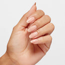 Hand with neatly manicured nails on a light gray background