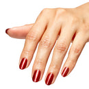 Hand with red nail polish on a white background