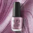 OPI nail polish bottle on a glittery purple background