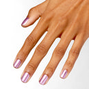 Hand with pink metallic nail polish on a white background