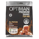 A 764g bag of Optiman Premium Shake For Him in Caramel flavor by Optislim. The packaging is dark brown with silver metallic borders at the top and bottom, featuring white and gold text, and an image of caramel-topped ice cubes on the lower right.