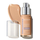 Revlon Illuminance foundation bottle with applicator on a white background