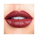 Close-up of a person wearing a glossy red lipstick on a white background