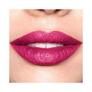 Close-up of a person wearing bright pink lipstick on a white background