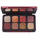 Makeup palette with various shades of eyeshadows and a glittery color, branded with 'R'.