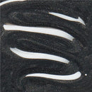 Close-up of a textured black surface with white curved lines.