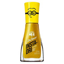 A bottle of Sally Hansen x Despicable Me 4 Insta-Dri nail polish in a metallic gold shade, featuring a yellow cap with a Minion glasses graphic, on a white background.