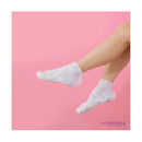 White socks worn on feet against a pink background with 'Skin Republic' branding.