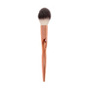 Makeup brush with rose gold handle on a white background