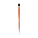 Makeup brush with brown handle and black bristle head on a white background