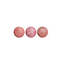 Three pink makeup products on a white background