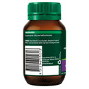 Brown supplement bottle with green cap on a white background