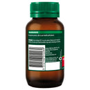 Brown bottle with green cap on a white background