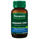 A bottle of Thompson's Organic Zinc dietary supplement, featuring an amber brown bottle, a green cap, and a dark green label with white and blue text.