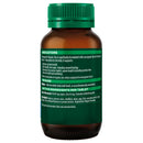 Brown supplement bottle with green cap and label on a white background