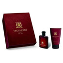 Trussardi perfume set with red box, bottle, and tube on a white background