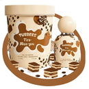 TUBBEES Tira-Miss-you Eau de Parfum shown as a matching perfume bottle and cylindrical carton, both decorated with brown chocolate-coated wafer and coffee bean graphics on a cream background, with a few wafer slices arranged in front on a white studio background.